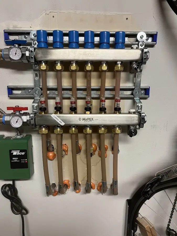 Plumber performing Water Heater Repair at a residential property in Falls Church